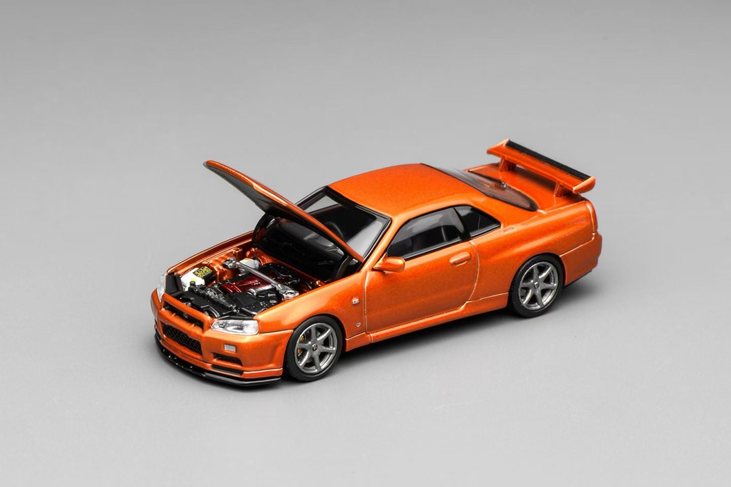 (Preorder) Motorhelix 1:64 Nissan Skyline GT-R (R34) V-Spec II Customized - Orange M63471