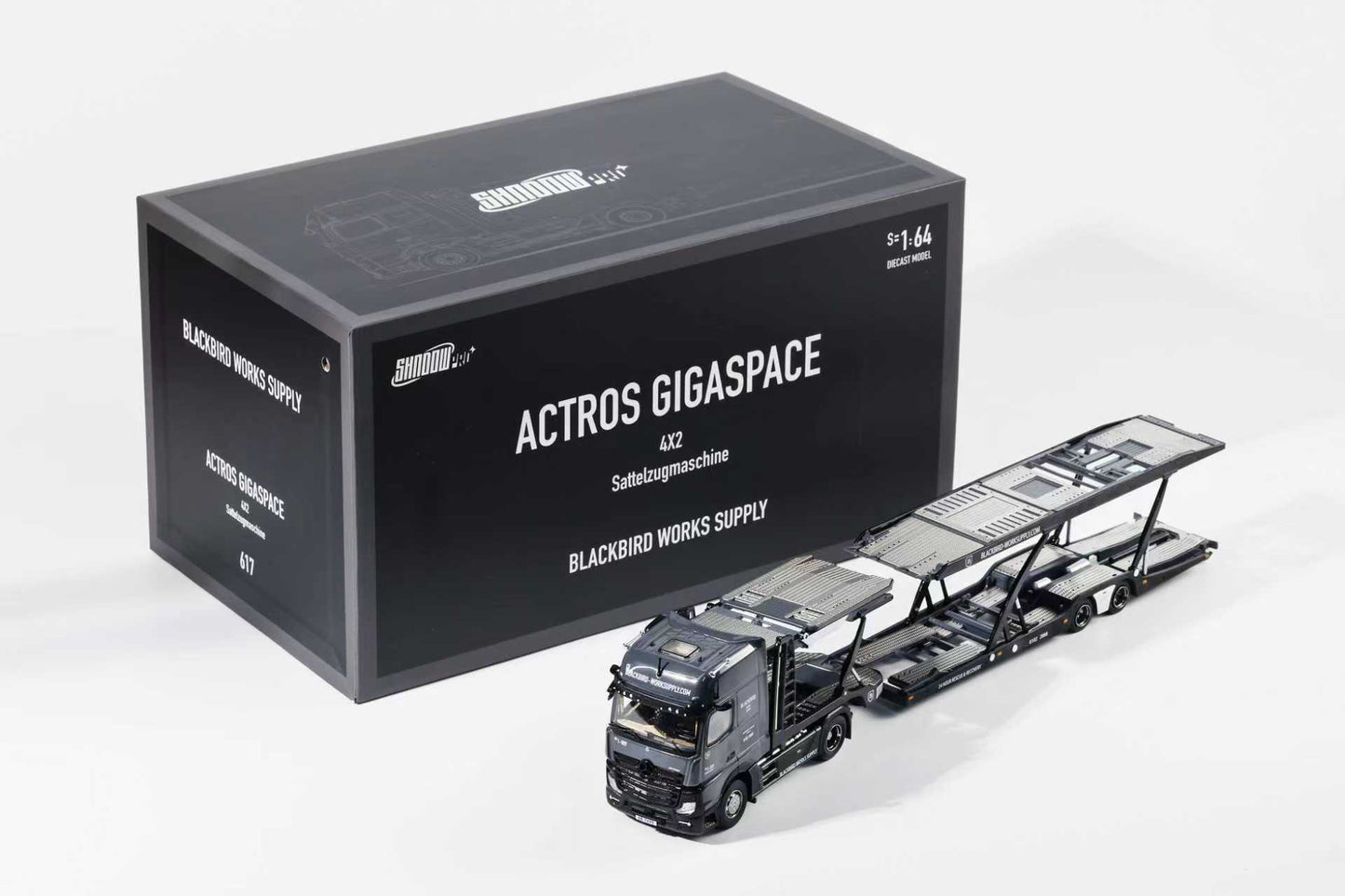 Model truck and packaging box of Actros Gigaspace with 'Blackbird Works Supply' branding on a white background.