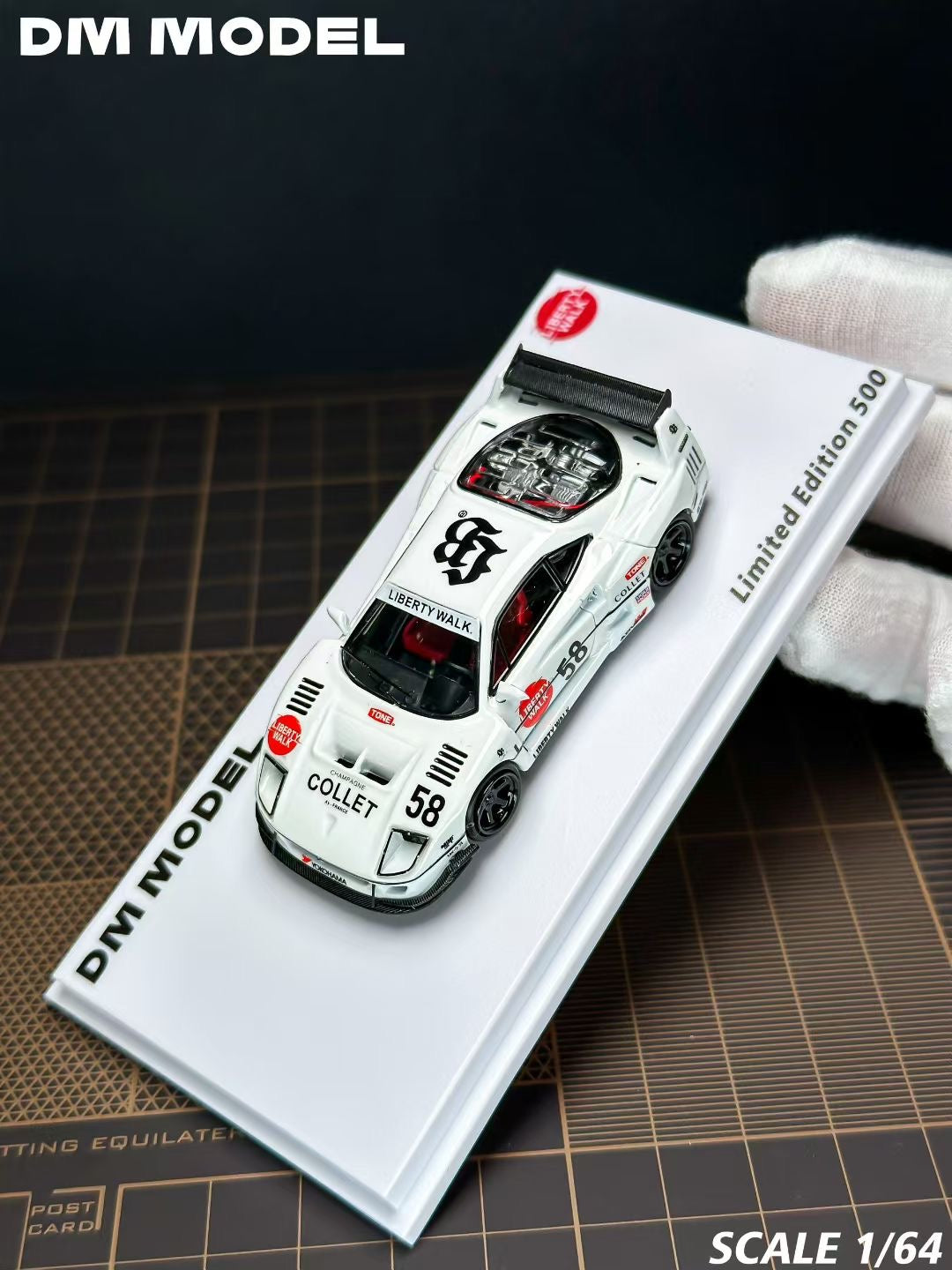 Model car on a display stand with 'DM Model' branding