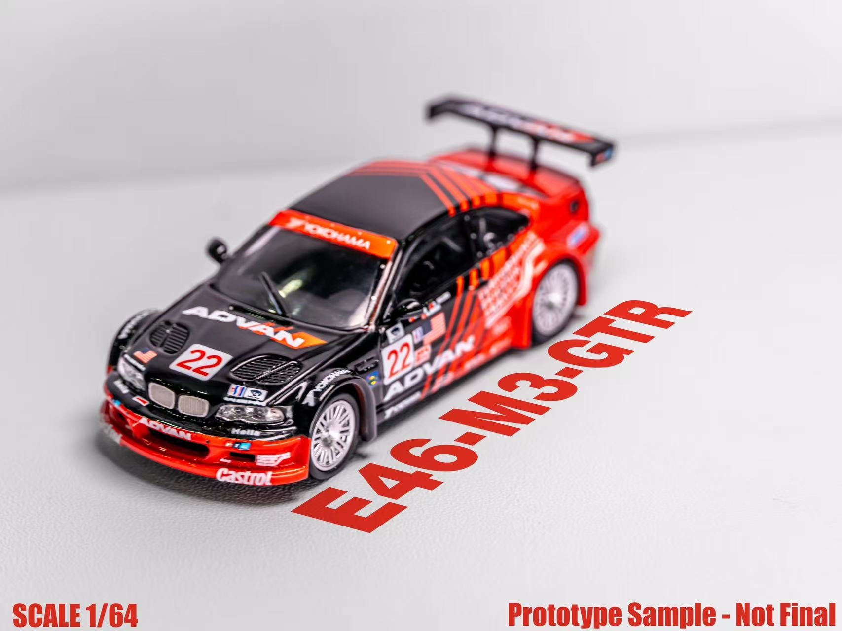 Model car with red and black design on a gray background