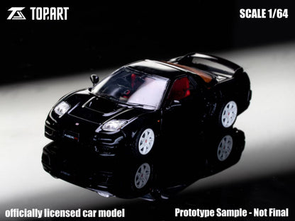 Black model car on a reflective surface with 'Topart' branding and scale information.