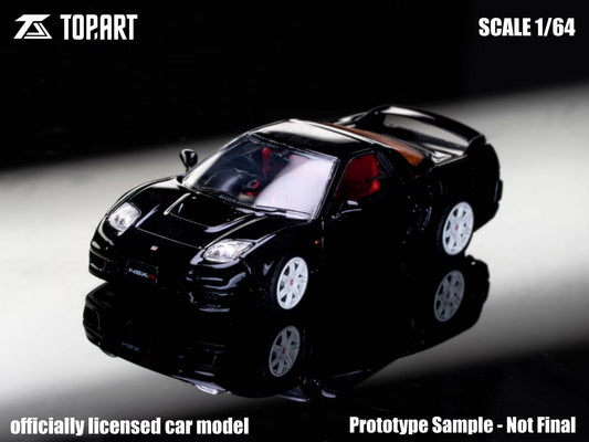 Black model car on a reflective surface with 'Topart' branding and scale information.
