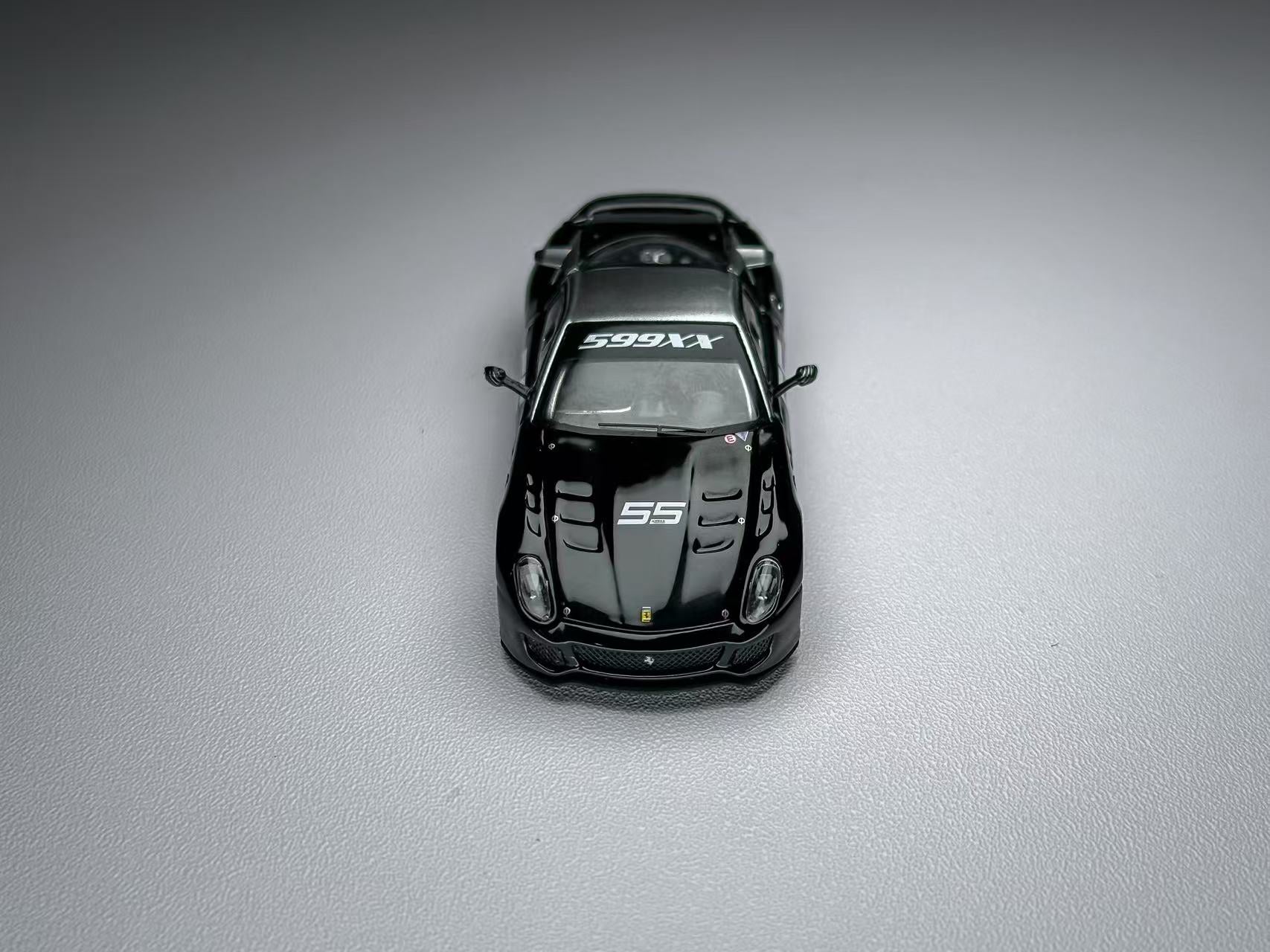 Black sports car model on a gray background