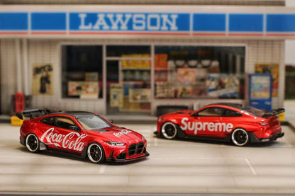 Two red sports cars with brand logos in front of a Lawson store.