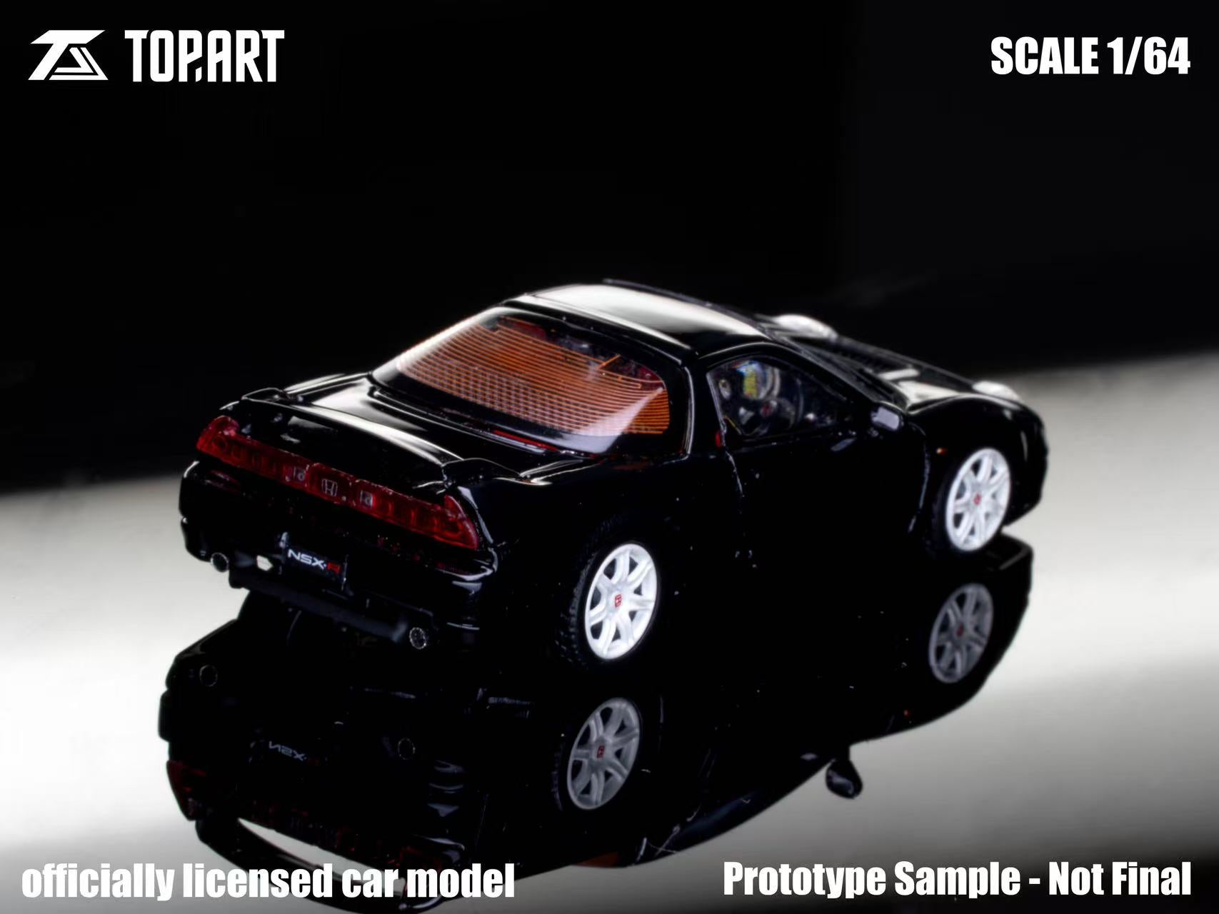 Black model car on a reflective surface with 'Topart' branding.