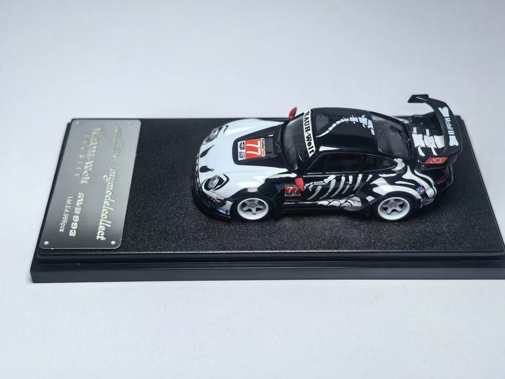 Model car on a display stand with a white background