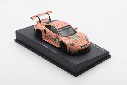 Model car with a unique design on a black platform against a white background
