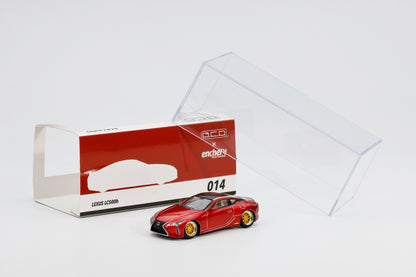 Red Lexus LC500 model car with packaging on a white background