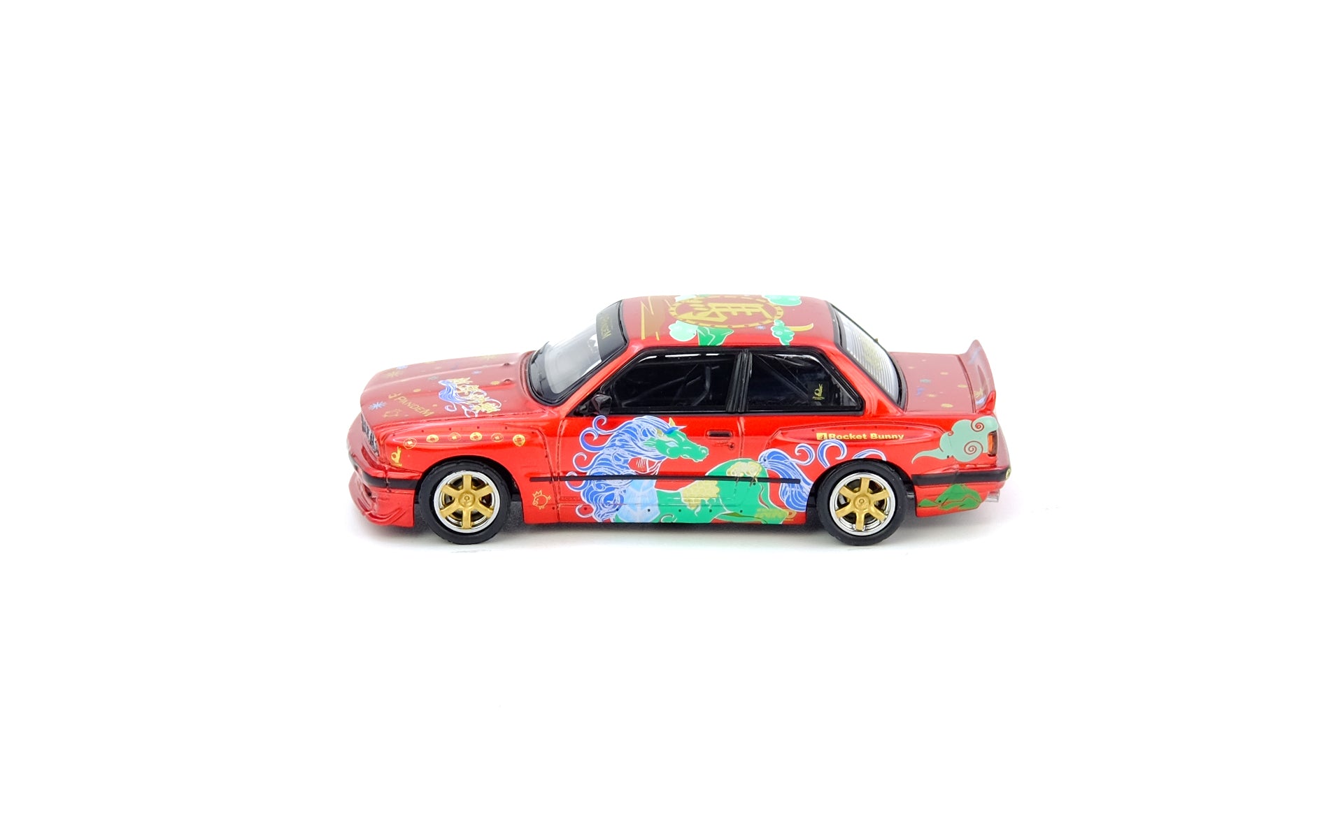 Colorful toy car with floral design on a white background