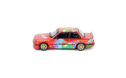 Colorful toy car with floral design on a white background