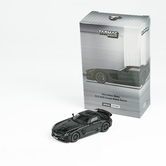 Model of a Mercedes-Benz SLS AMG Coupé in black with packaging on a white background. The box shows the car's image and reads "Special Edition."